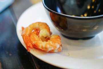 Fresh raw shrimps set with vegatables on the bamboo basket ready for cooking