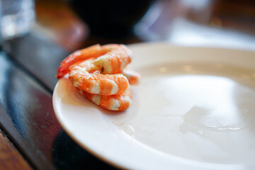 Fresh raw shrimps set with vegatables on the bamboo basket ready for cooking