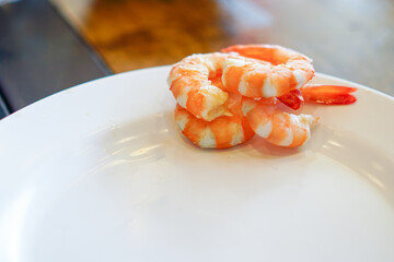 Fresh raw shrimps set with vegatables on the bamboo basket ready for cooking