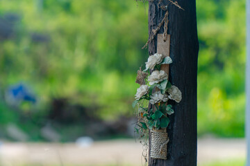 beautiful fake flower on the  post with beautiful background