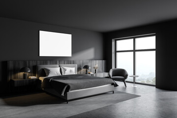 Gray bedroom corner with poster and armchair