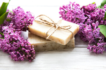 Natural soap and lilac flowers