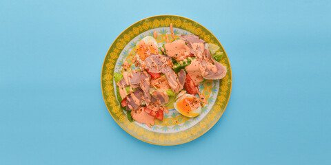 Mixed salad - ham, boiled eggs, lettuce and sauce. Delicious and healthy meal concept.