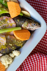 Rainbow trout with vegetables ready to oven cook.