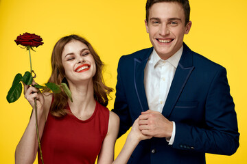 Couple in love man and woman with red rose classic costume red dress model