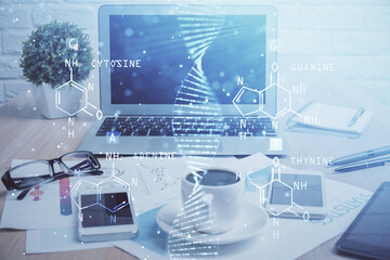 Desktop computer background and DNA drawing. Double exposure. Science concept.