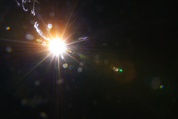 Abstract imitation sun starlight distant galaxy on a black background.