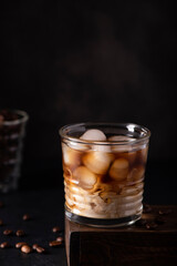 black ice coffee with milk in a glass