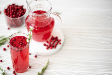 Fototapeta na wymiar lingonberry juice with honey in glass