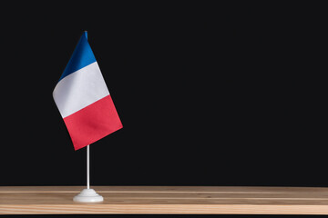 National table flag of France on black background. Tri-color flag blue white red
