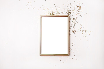Empty gold frame for text and gold stars Christmas decor. Flat lay style. Blank for a holiday wish