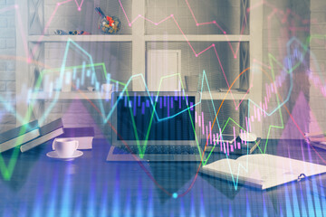 Financial market graph hologram and personal computer on background. Double exposure. Concept of forex.