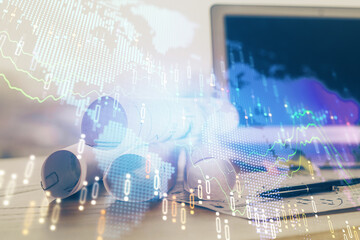 Stock market chart hologram drawn on personal computer background. Double exposure. Concept of investment.