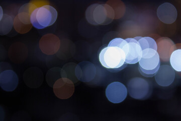 abstract background with bokeh defocused lights from cityscape at night