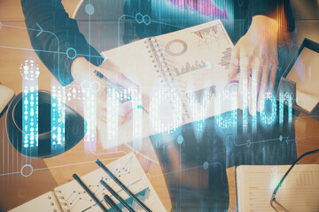 Multi exposure of woman's writing hand on background with data technology hud. Big data concept.