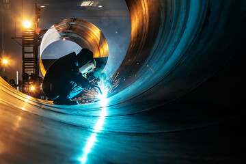 The welder is welding steel plates