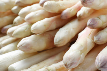 Fresh ripe white asparagus as background, closeup