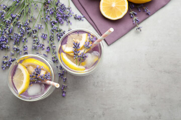 Fresh delicious lemonade with lavender on grey table, flat lay. Space for text