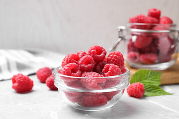 Delicious fresh ripe raspberries on light grey table
