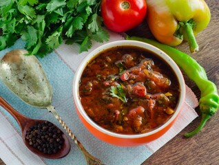 Bowl of traditional soup Borscht on table