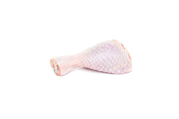 Fresh raw chicken drumstick on a white background.