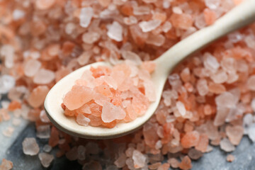 Fototapeta na wymiar Spoon with pink himalayan salt, closeup view