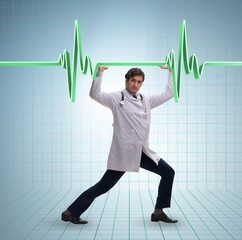 Doctor cardiologist supporting cardiogram heart line