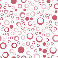 Seamless pattern of repeating pink circles of different sizes.
