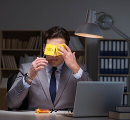 The businessman staying late to sort out priorities