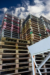 Palettes of different colours on the recycling area