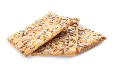 Delicious crispy crackers with different seeds isolated on white