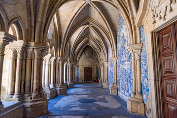 Cloister decorated with Azulejo mural in Porto Cathedral, a Catholic church in Porto, Portugal