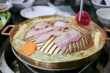 Pork, Shredded carrot, Shredded cabbage grill on BBQ brass pan, focus selective.