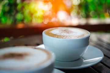 Coffee in white cup on table at coffee shop