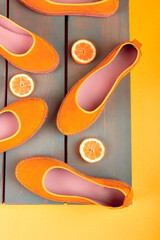 Yellow espadrilles shoes near slices of lemon