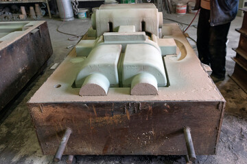 View of the sand mold for steel casting. Sand casting, also known as sand molded casting, is a...