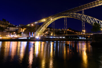 Fototapeta na wymiar Night view of Dom Luis I Bridge, a double-deck bridge across the River Douro in Porto, Portugal