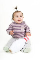 Little kid girl sitting and smiling