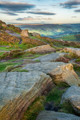 Fototapeta na wymiar Epic colorful landscape view of late Summer heather in Peak District around Higger Tor at sunrise