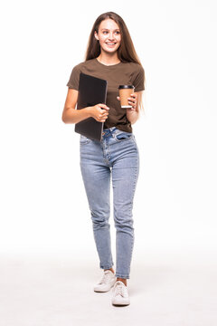 Full Size Young Woman Walking With Laptop And Coffee To Go, Smiling On White Background