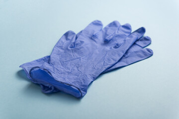 Latex gloves on blue background. Personal Protective Equipment.