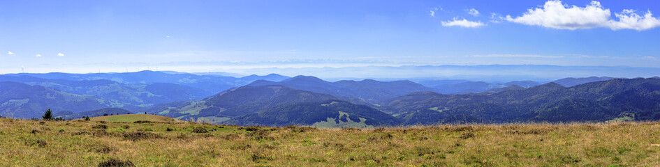 Panoramic view over the Black Forest and the Swiss Alps from the top of Belchen mountain