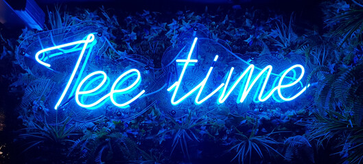 Neon blue light tee time