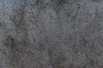 old concrete wall with cracks, scratches and stains closeup - construction element