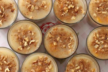 Traditional Turkish dessert Asure with walnuts. (Noah's Pudding). Close up.