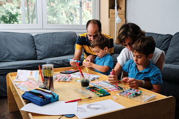 a family painting and playing with their kids