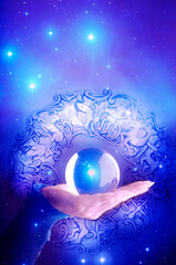 Fototapeta premium woman hand with crystal ball over blue background with stars, horoscope and zodiac and copy space like astrology concept