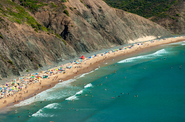 Magnificent beach at the foot of a cliff from an aerial view