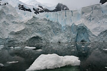 The beautiful Paradise Bay.Mammoth glaciers spear out of the ocean-blue sea, icebergs that have run...