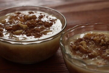 Traditional Turkish dessert Asure with walnuts. (Noah's Pudding). Close up.